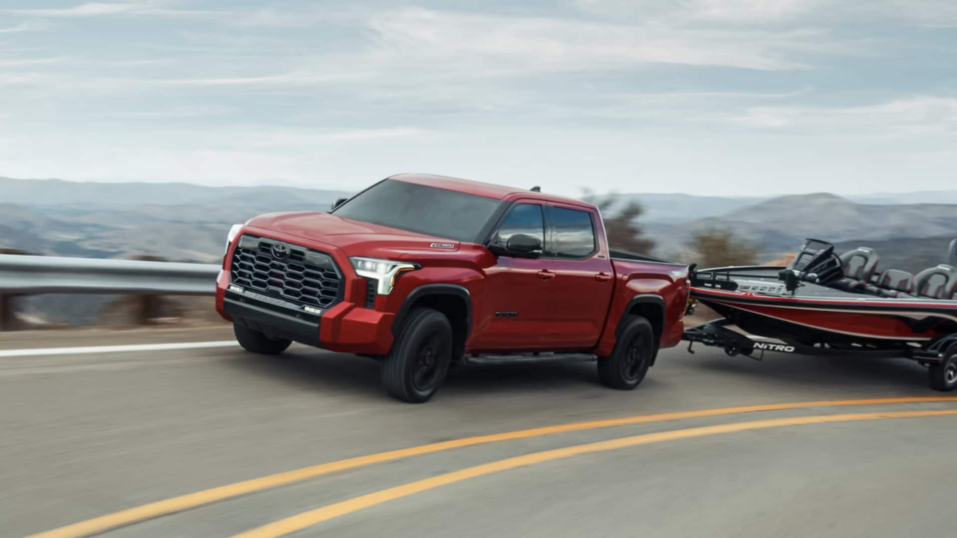 2025 Toyota Tundra shown in Supersonic Red* for sale at Stewart Toyota near me in Corsicana, TX.