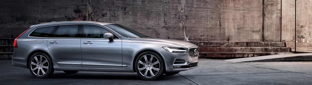 New Volvo V90 outside a modern home
