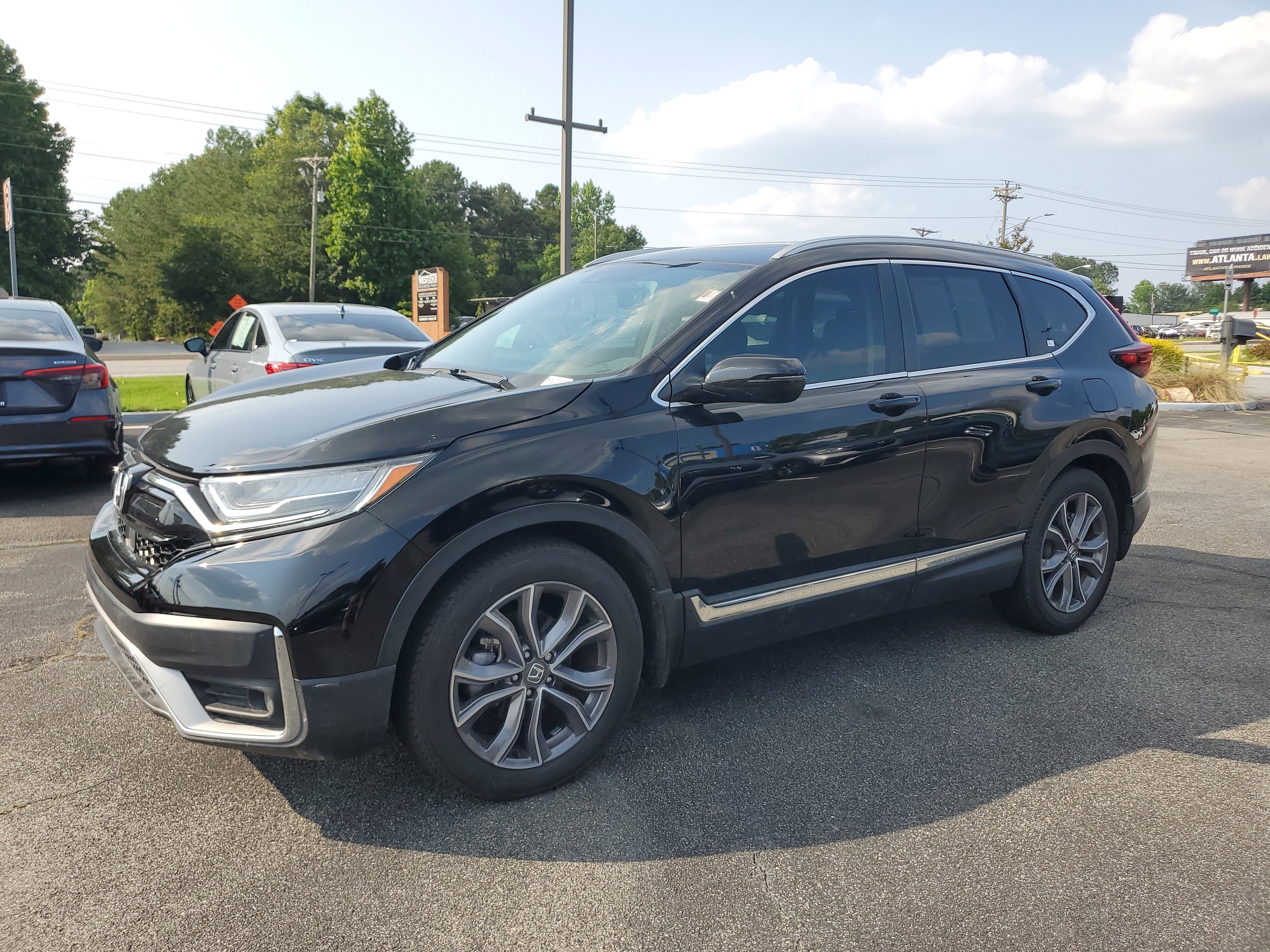 Used 2021 Honda CR-V Touring with VIN 5J6RW1H91ML008007 for sale in Snellville, GA