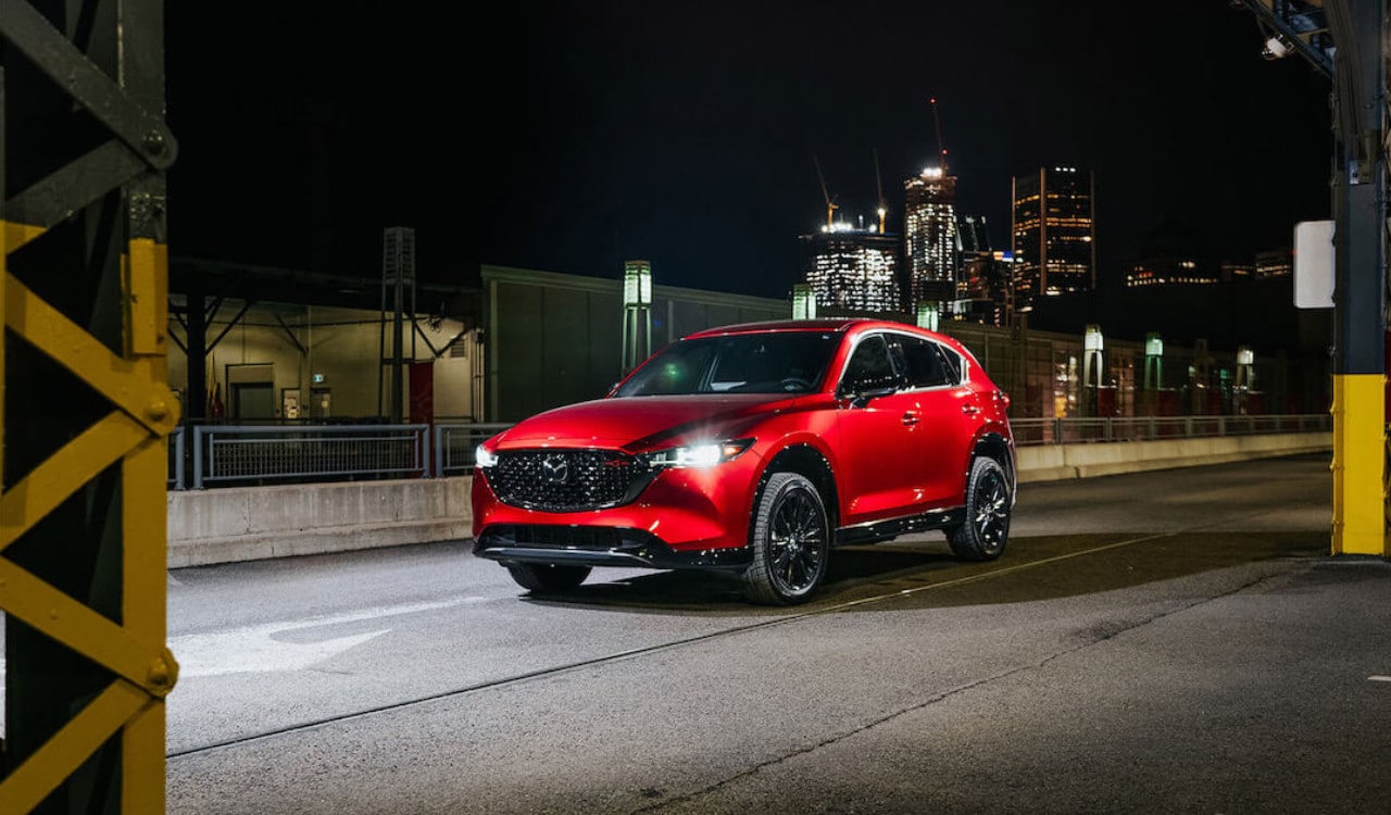 front side view of a 2023 Mazda CX-5 at night in a harbor