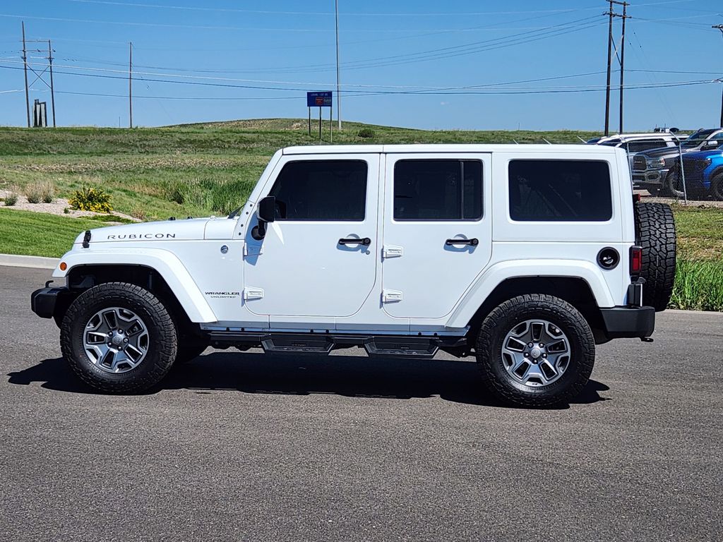 Used 2015 Jeep Wrangler Unlimited Rubicon with VIN 1C4HJWFG9FL683105 for sale in Cheyenne, WY