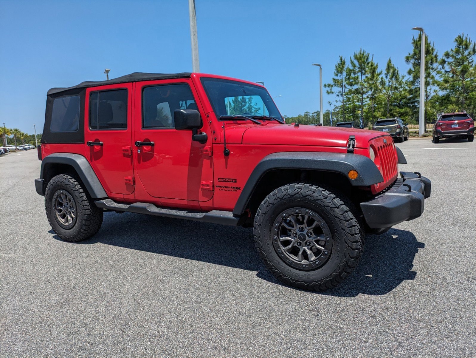 Used 2018 Jeep Wrangler JK Unlimited Sport with VIN 1C4BJWDG5JL823863 for sale in Daytona Beach, FL