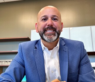 Staff member Carlos Uribe from ID_d568b663f924