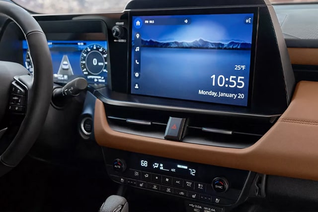 Outback's next-gen 12.1-inch infotainment touchscreen shown with tactile knobs and buttons bank below it.