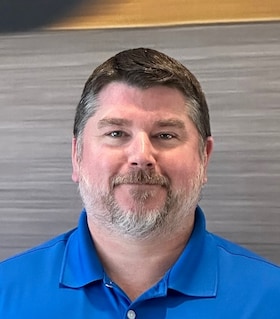 Staff member Larry Adamski from ID_a4d4d91b4b23