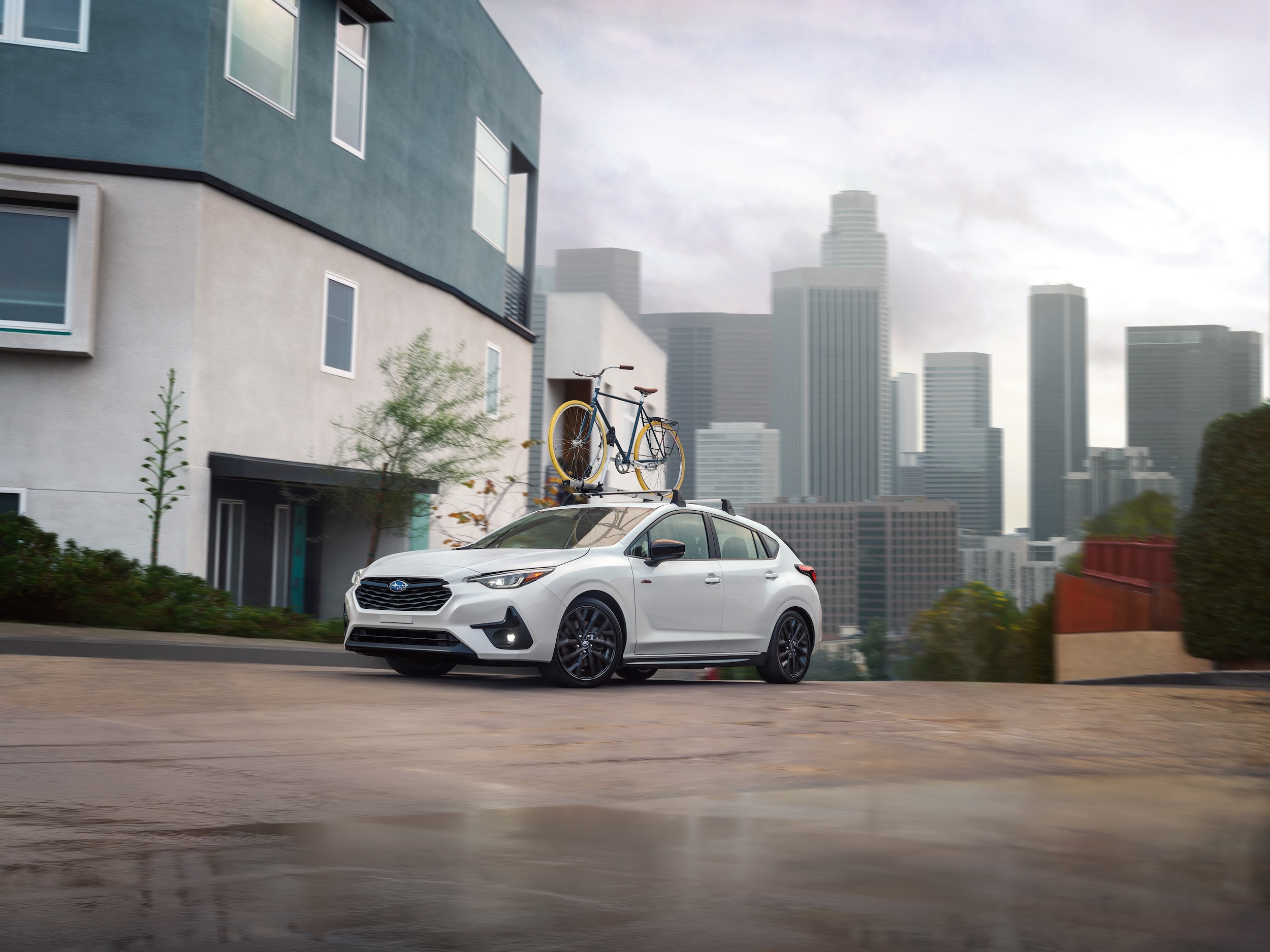  2025 Subaru Impreza carrying a bike on roof rack