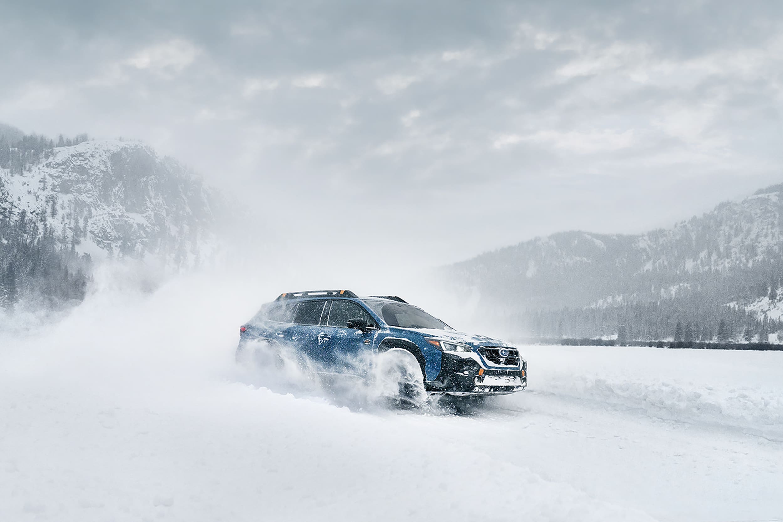 Subaru Outback driving through snow