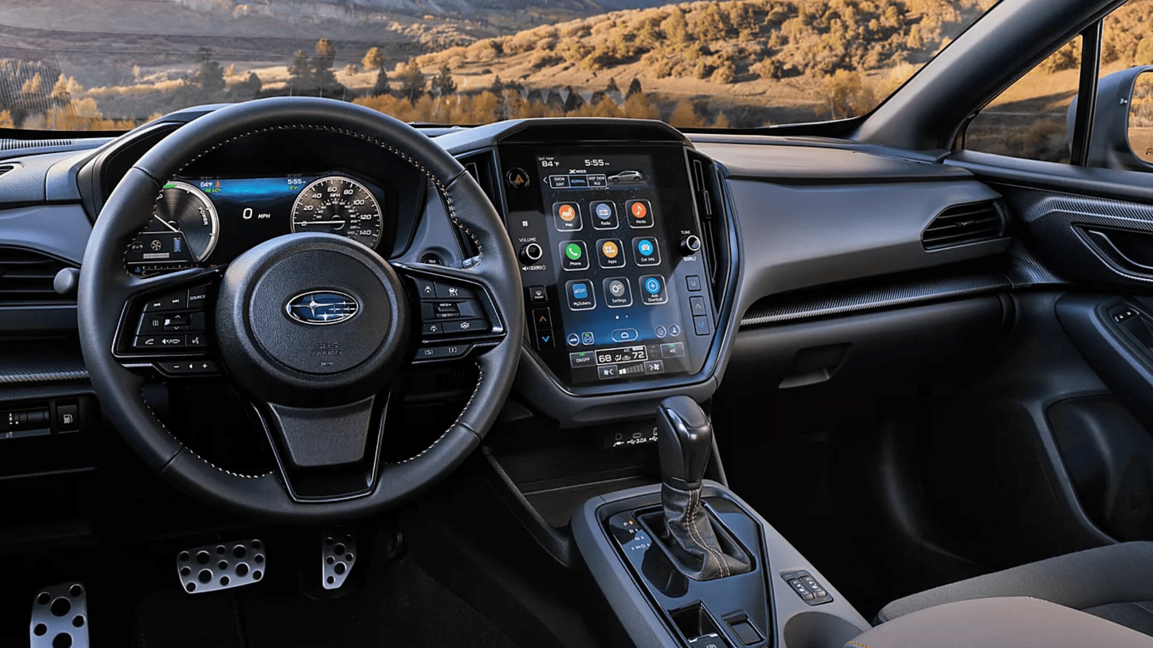 2026 Subaru Outback Wilderness all-black interior showing front and rear leather seats with touchscreen infotainment and mountain view through windows
