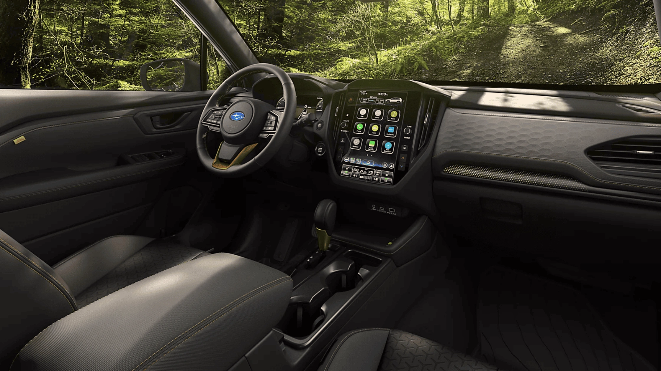 2026 Subaru Outback Wilderness cargo area loaded with camping gear including sleeping bag and trekking poles with rear hatch open in a desert setting