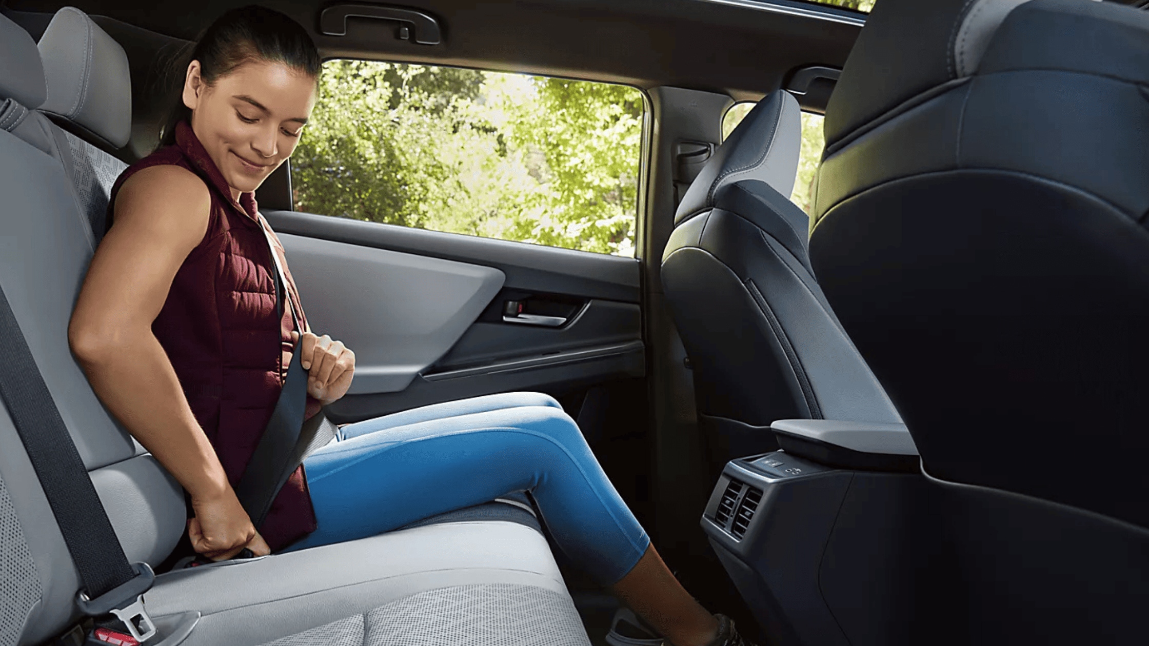 2026 Subaru Outback Wilderness all-black interior showing front and rear leather seats with touchscreen infotainment and mountain view through windows