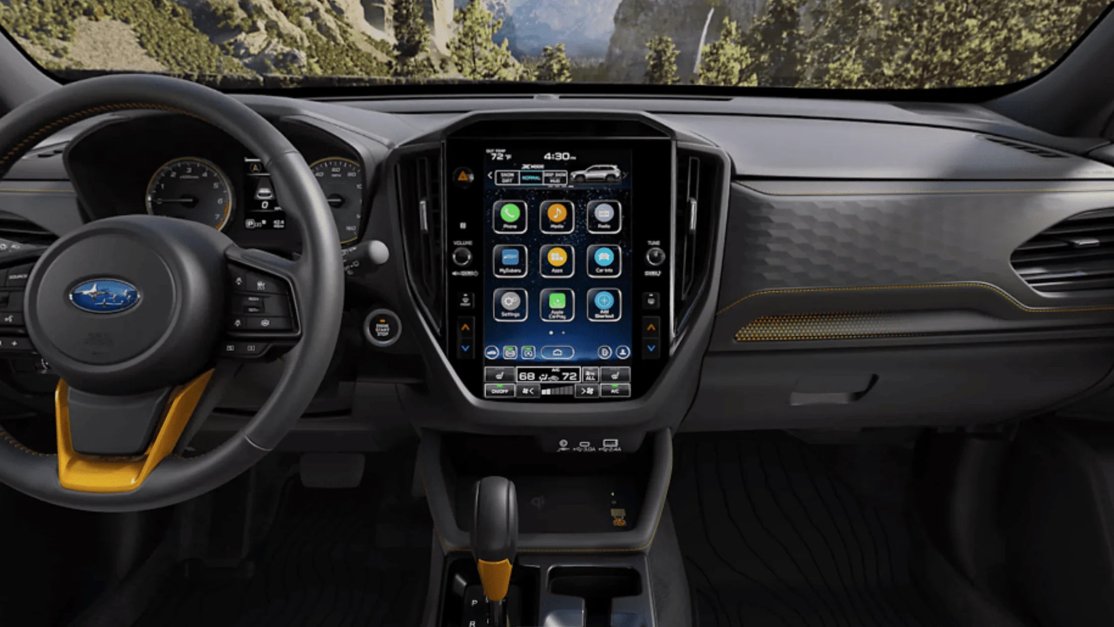 2026 Subaru Outback Wilderness all-black interior showing front and rear leather seats with touchscreen infotainment and mountain view through windows