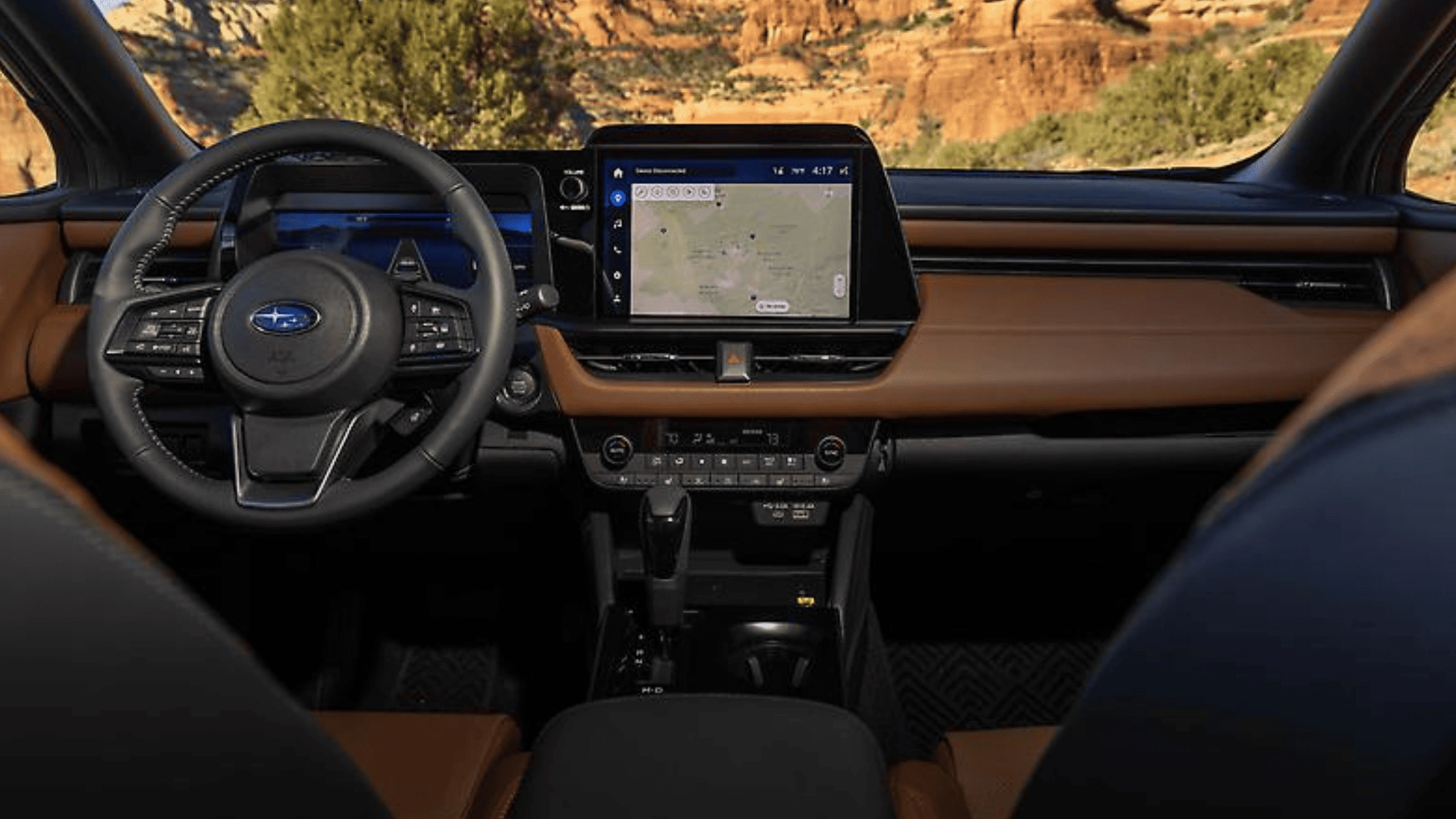 2026 Subaru Outback dashboard with touchscreen navigation display and tan interior trim in Pueblo, CO.