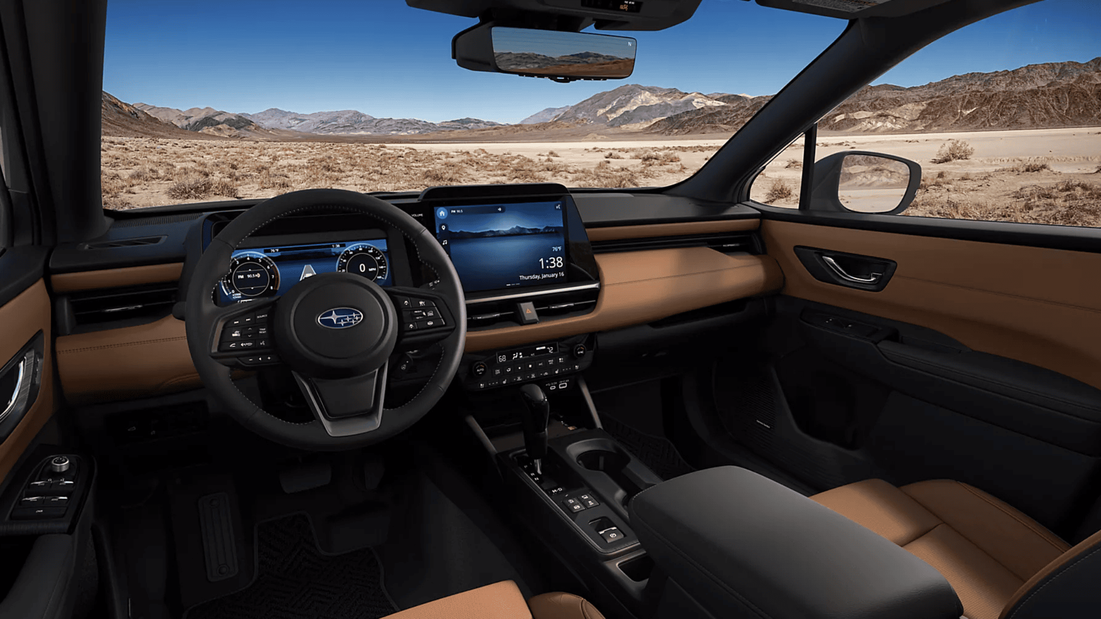 2026 Subaru Outback Wilderness all-black interior showing front and rear leather seats with touchscreen infotainment and mountain view through windows