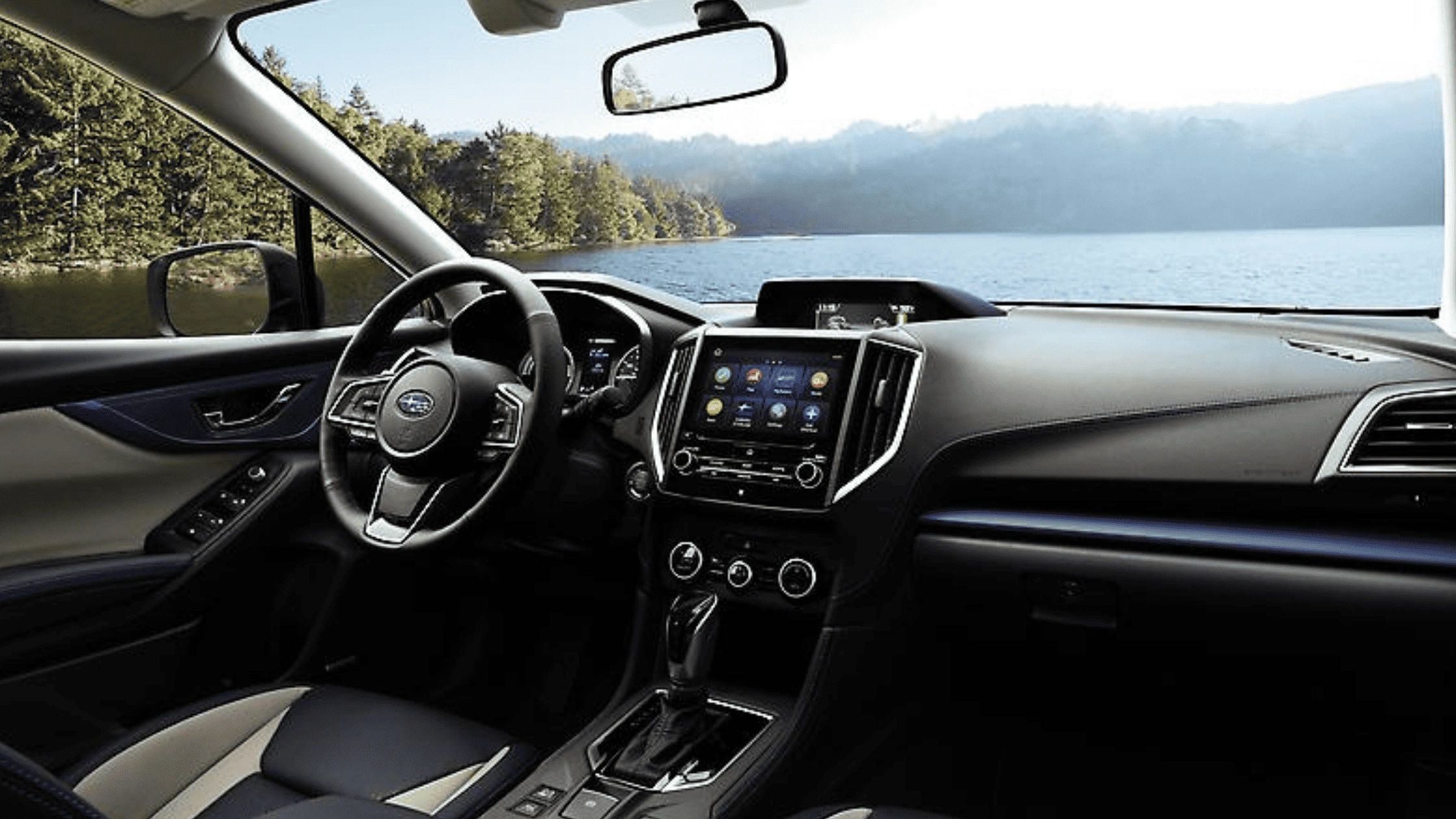 2026 Subaru Crosstrek Hybrid dashboard with touchscreen infotainment display and Subaru steering wheel in Pueblo, CO.