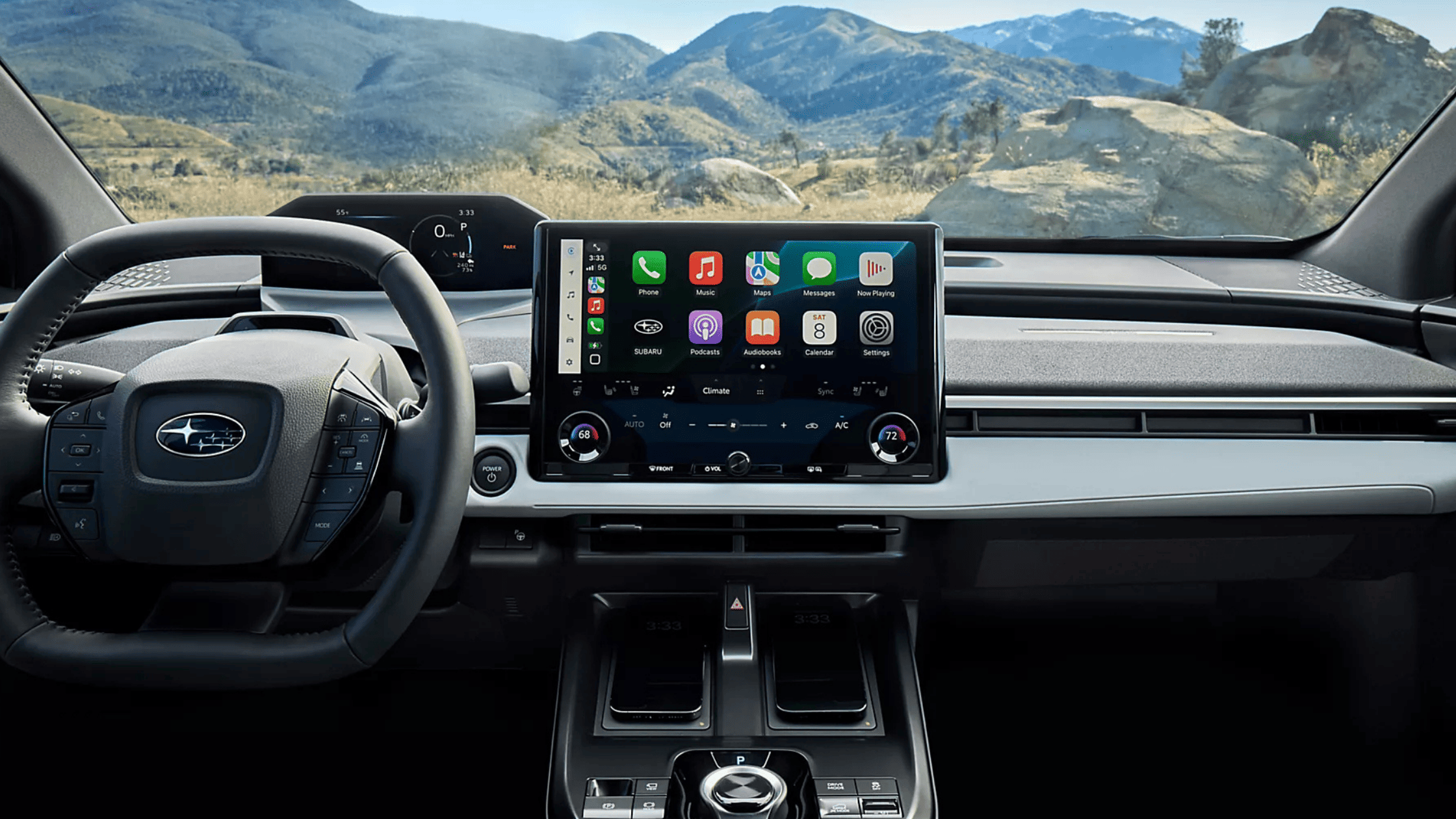 2026 Subaru Outback Wilderness all-black interior showing front and rear leather seats with touchscreen infotainment and mountain view through windows