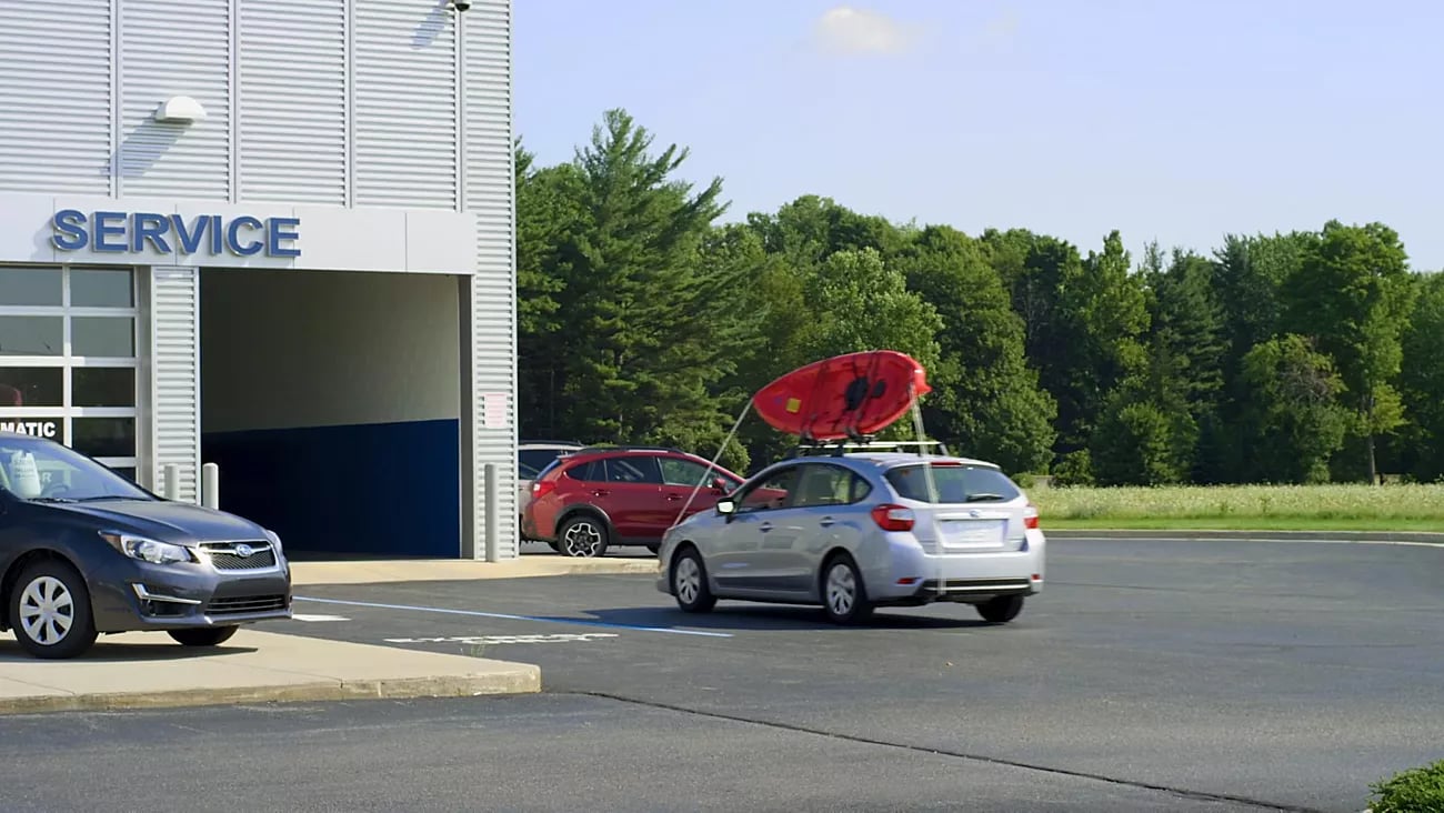 View of two passengers in a 2025 Subaru SUV looking down through the panoramic moonroof