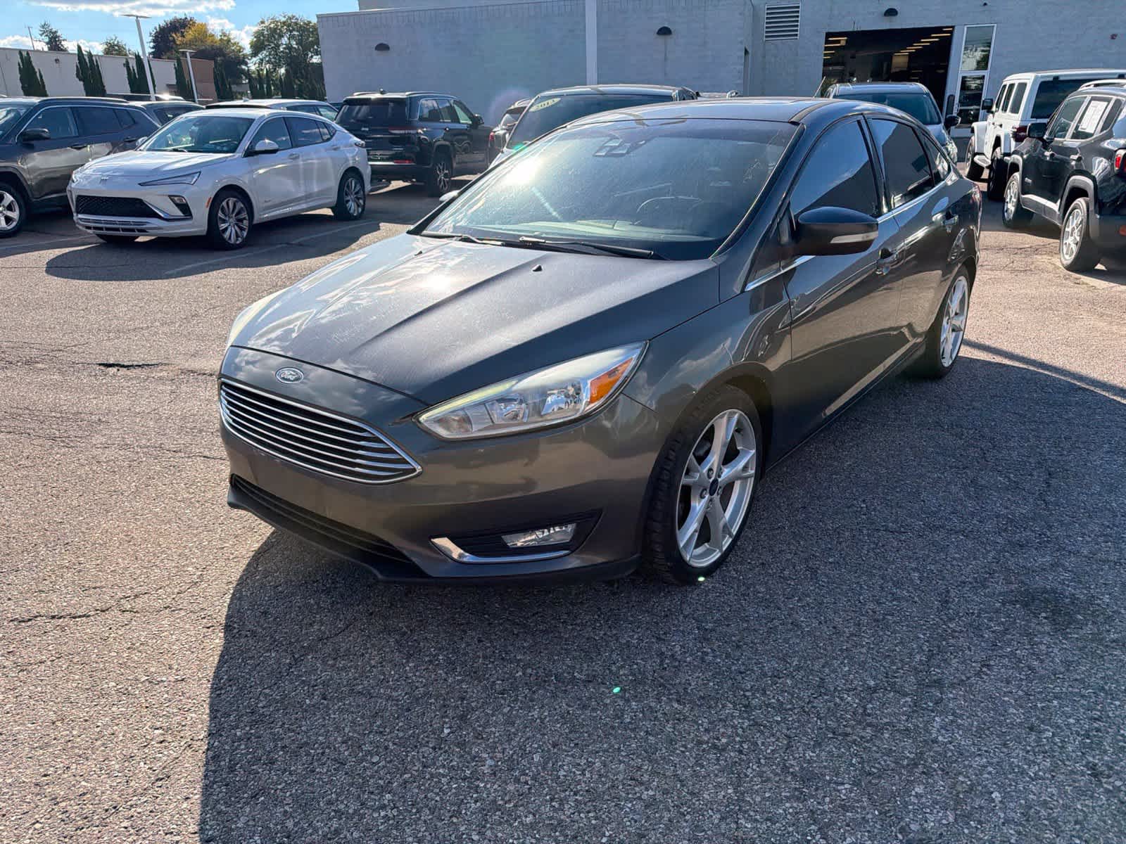 Used 2016 Ford Focus Titanium with VIN 1FADP3J21GL202567 for sale in Farmington Hills, MI