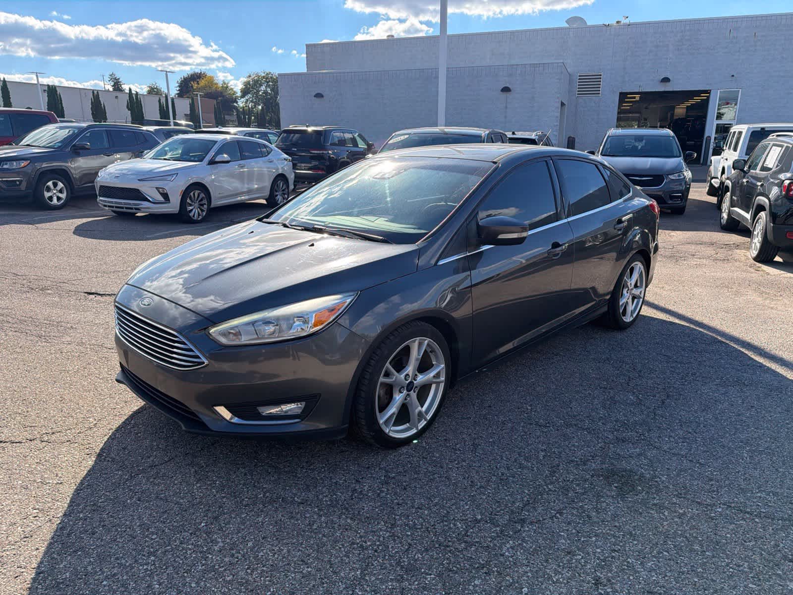 Used 2016 Ford Focus Titanium with VIN 1FADP3J21GL202567 for sale in Farmington Hills, MI