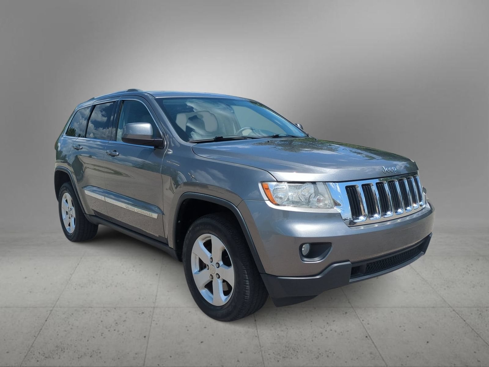 Used 2013 Jeep Grand Cherokee Laredo with VIN 1C4RJFAG0DC582348 for sale in Farmington Hills, MI