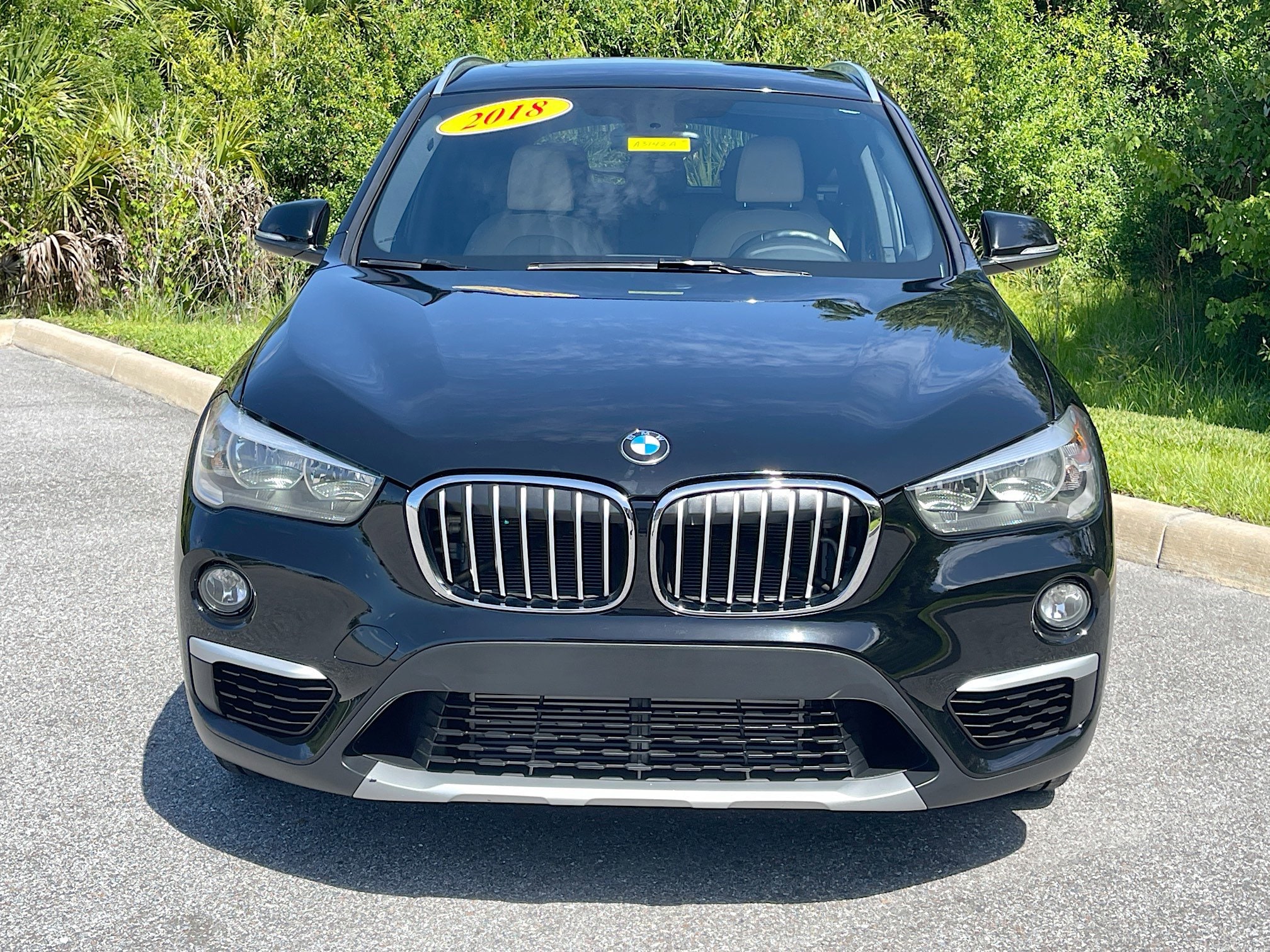 Used 2018 BMW X1 28i with VIN WBXHU7C39J5L07731 for sale in Sarasota, FL