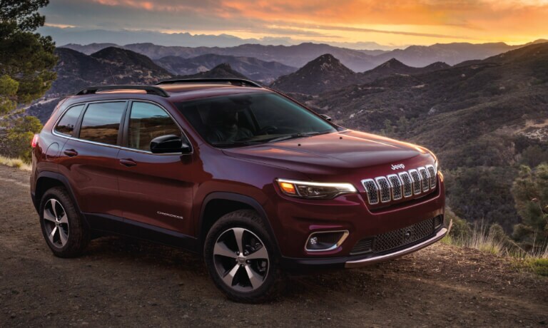 2023 Jeep Cherkoee along a mountainside sunset