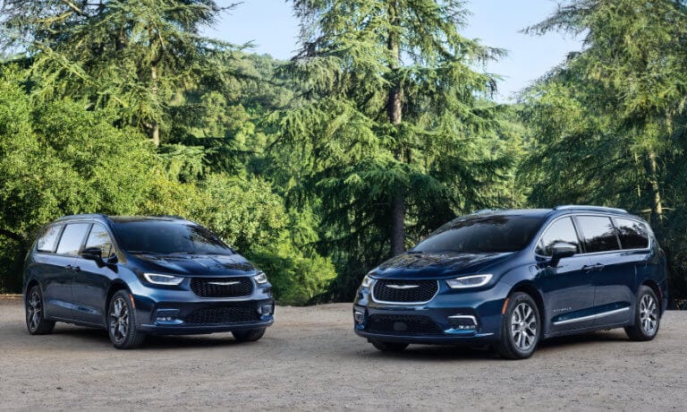 Two 2025 Chrysler Pacificas parked in forest