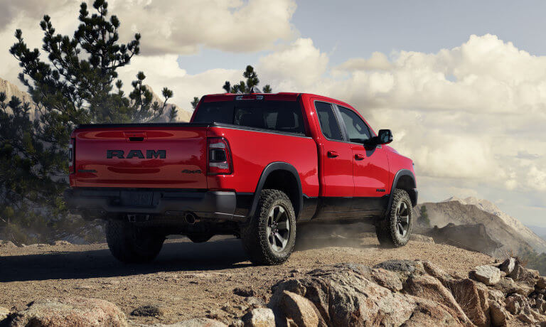 2020 Ram 1500 in red exterior parked by mountain