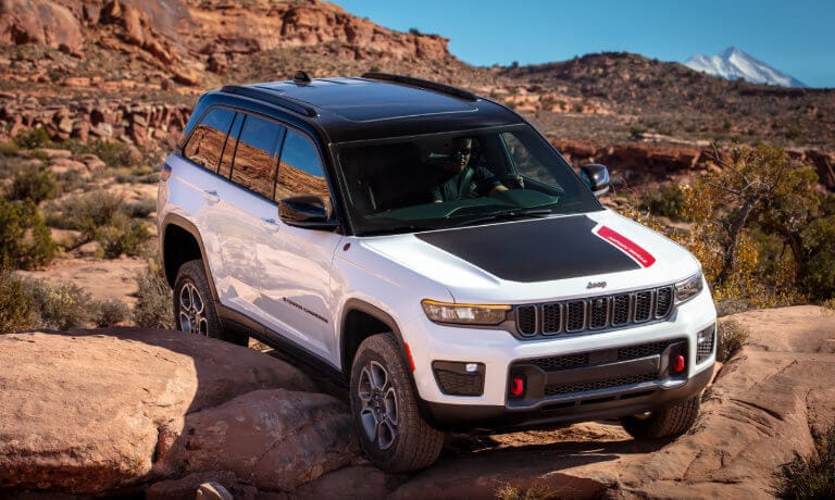 2022 Jeep Grand Cherokee going offroading in a desert