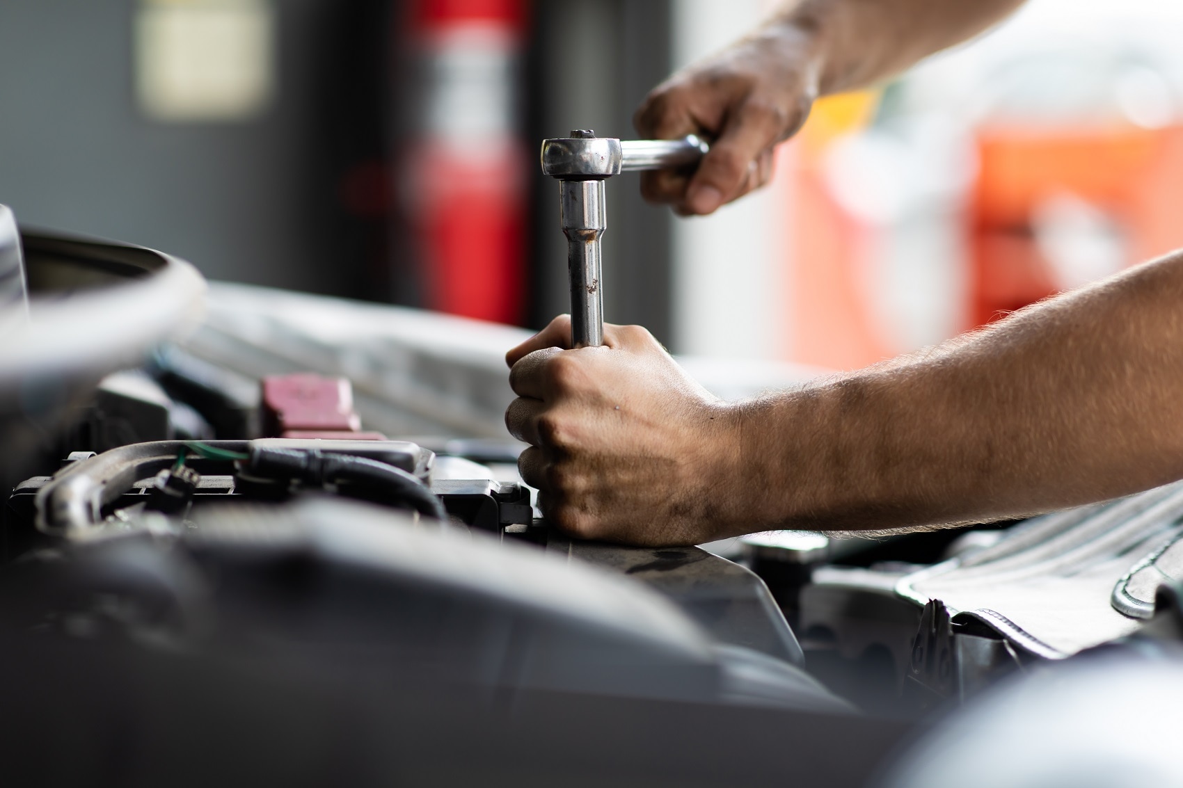 man using wrench