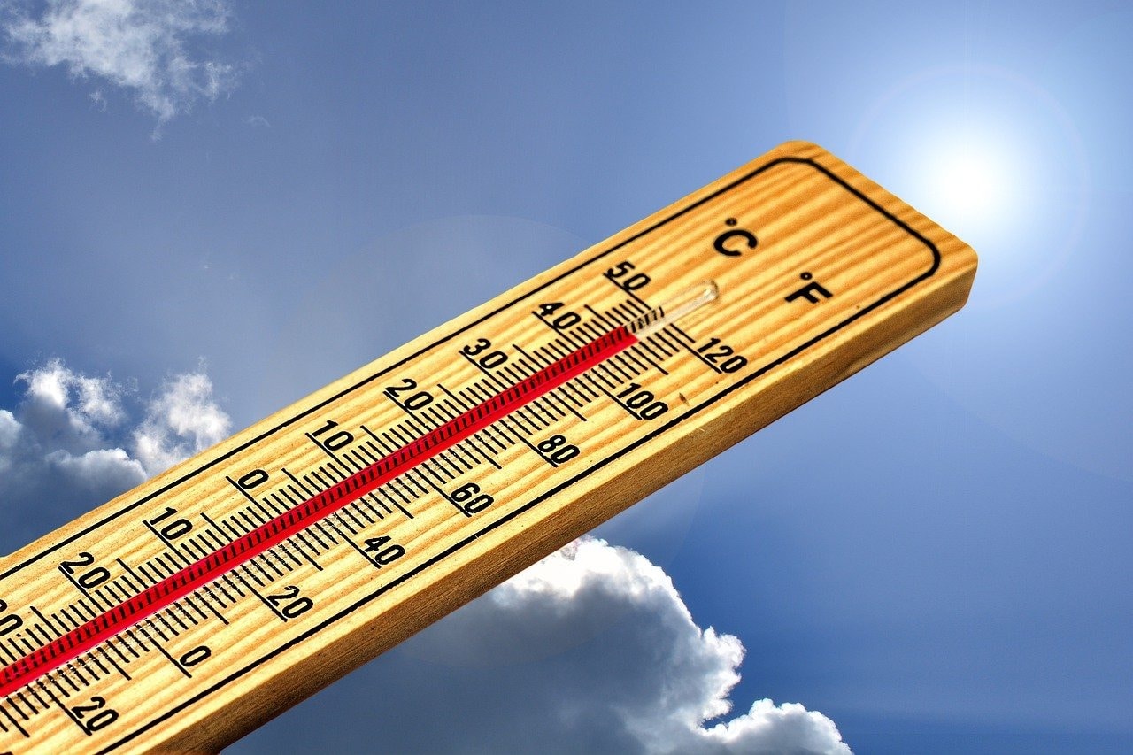 Temperature rising on a wooden thermometer