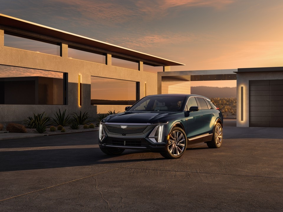2024 Cadillac LYRIQ parked outside of a modern home