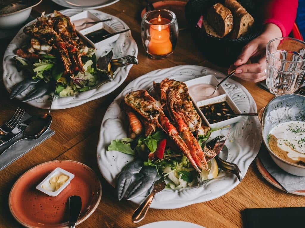 Seafood dishes on a table at a restaurant