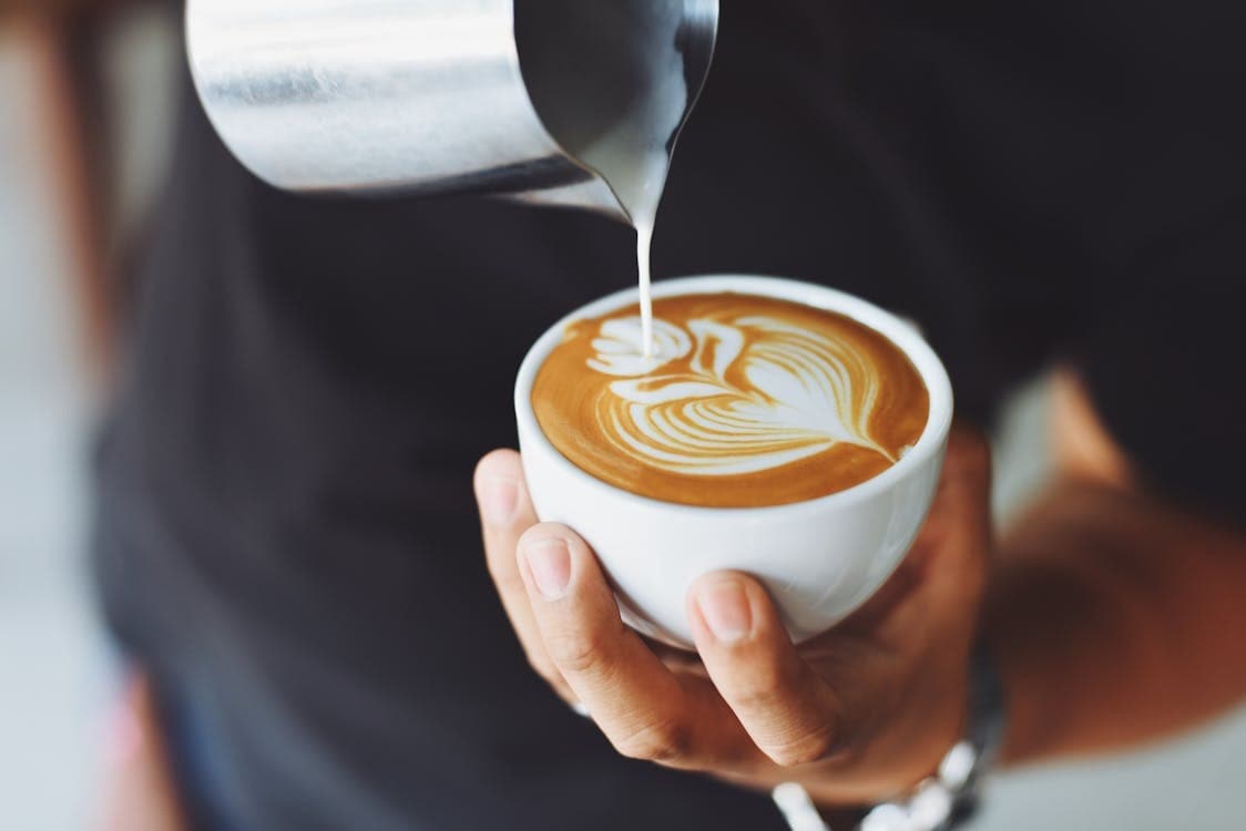 Coffee being poured into a cup