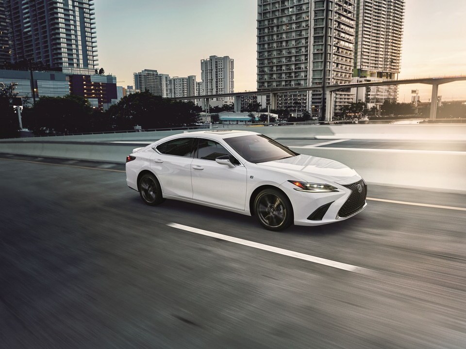  Person cheerfully signing documents.