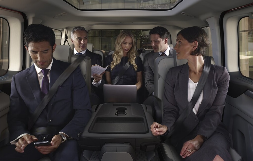  Person cheerfully signing documents.