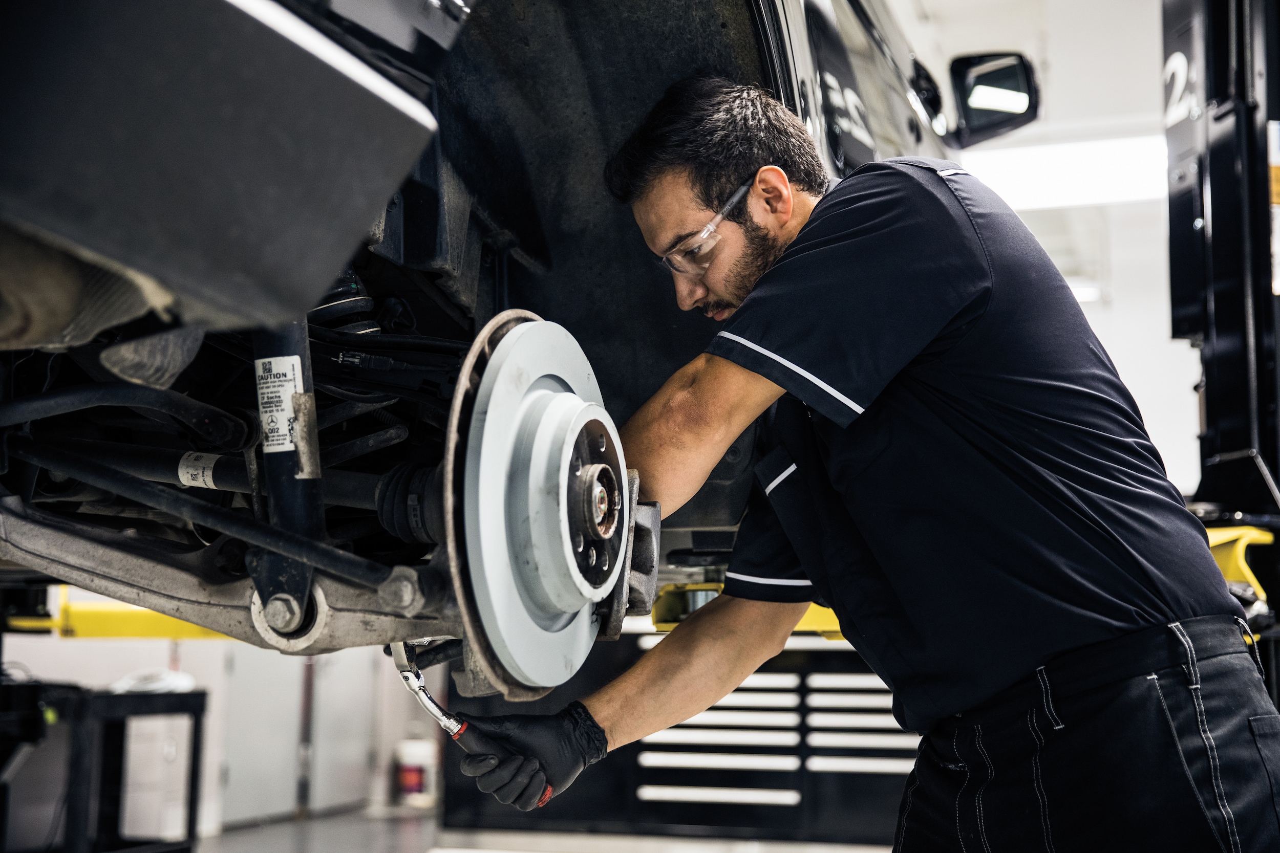  Person cheerfully signing documents.