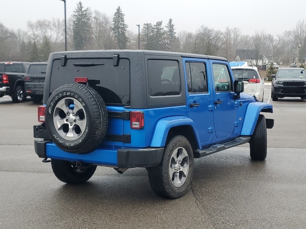 Used 2016 Jeep Wrangler Unlimited Sahara with VIN 1C4HJWEG5GL237259 for sale in New Hudson, MI