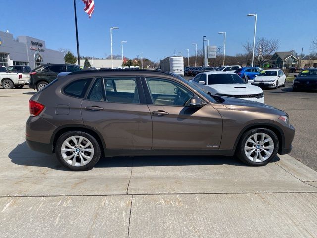 Used 2013 BMW X1 28i with VIN WBAVL1C52DVR83084 for sale in Highland Charter Township, MI