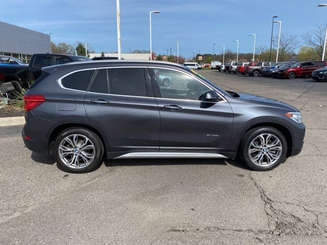 Used 2017 BMW X1 28i with VIN WBXHT3Z36H4A57337 for sale in Highland, MI