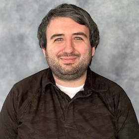 Staff member Xander Thompson from fa8fa34e3ff9