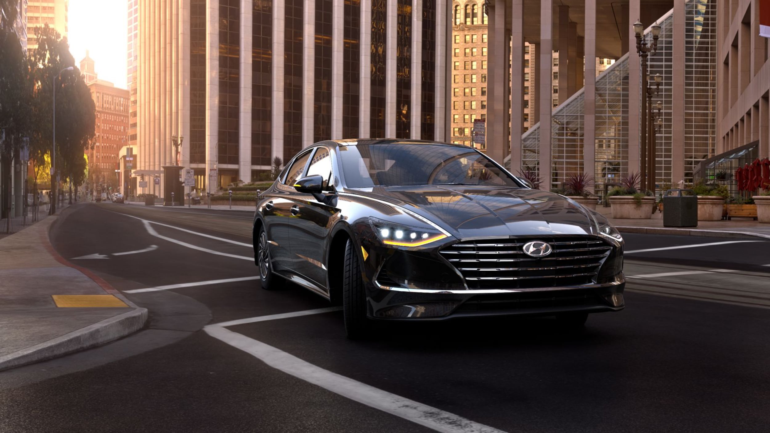 2023 black Hyundai Sonata Hybrid driving in city