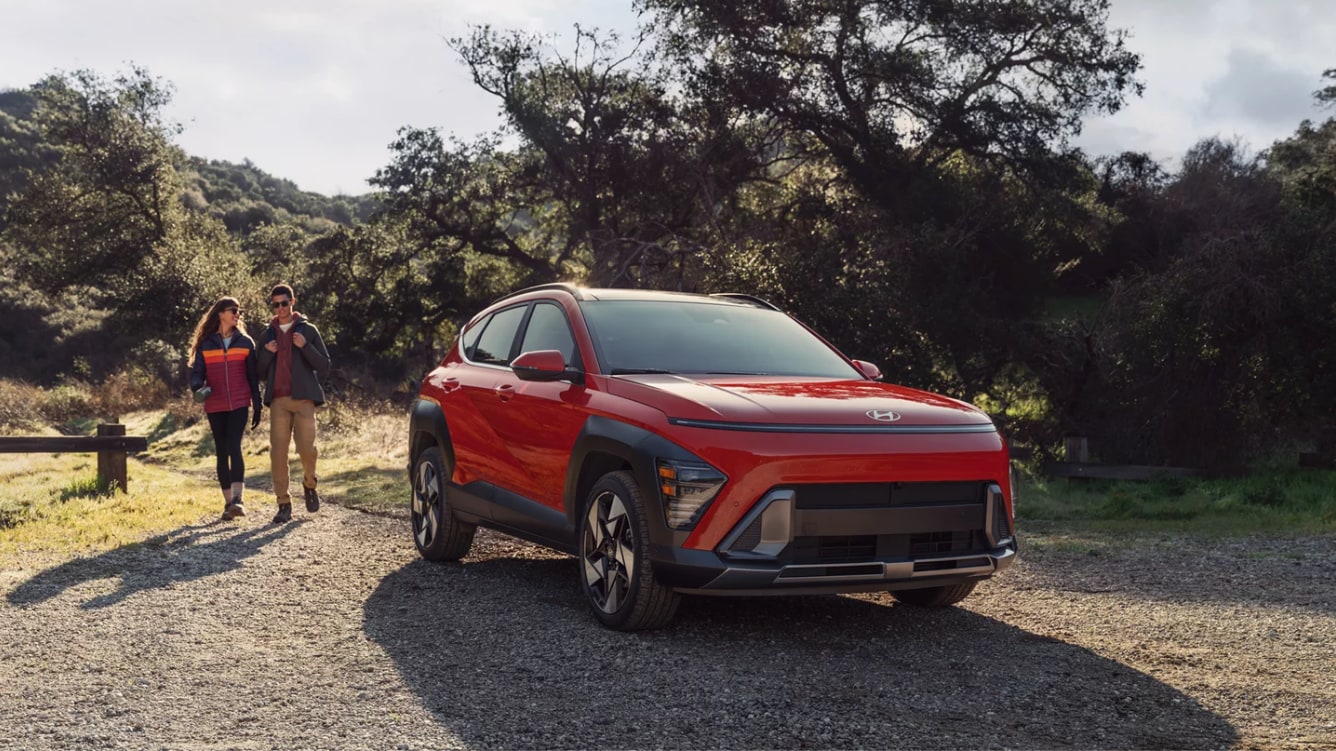 2025 Hyundai Kona Limited parked in off-road setting with two people walking behind it