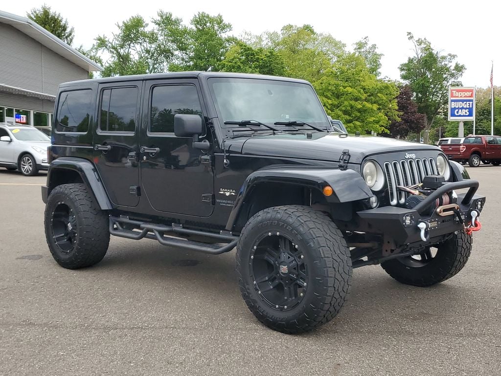 Used 2016 Jeep Wrangler Unlimited Sahara with VIN 1C4BJWEG6GL219715 for sale in Paw Paw, MI