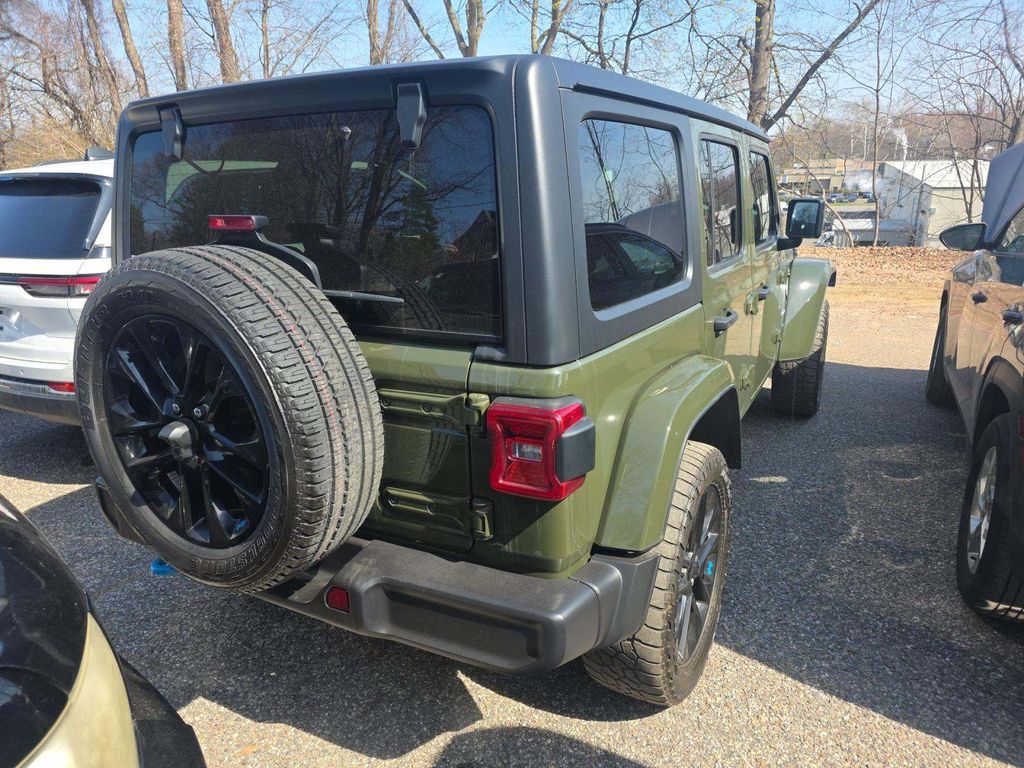 Used 2022 Jeep Wrangler Unlimited Sahara 4XE with VIN 1C4JJXP61NW280861 for sale in Plantation, FL