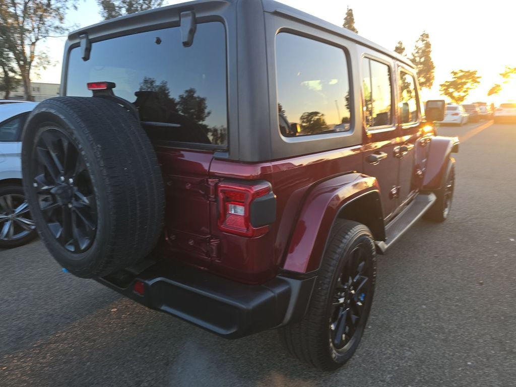 Used 2022 Jeep Wrangler Unlimited Sahara 4XE with VIN 1C4JJXP69NW108495 for sale in Plantation, FL
