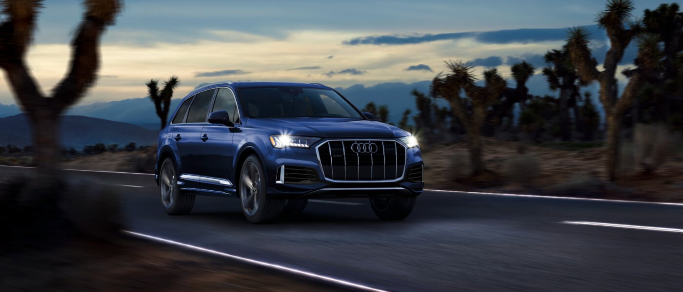 2021 Blue Audi Q7 Driving on a Desert Road at night