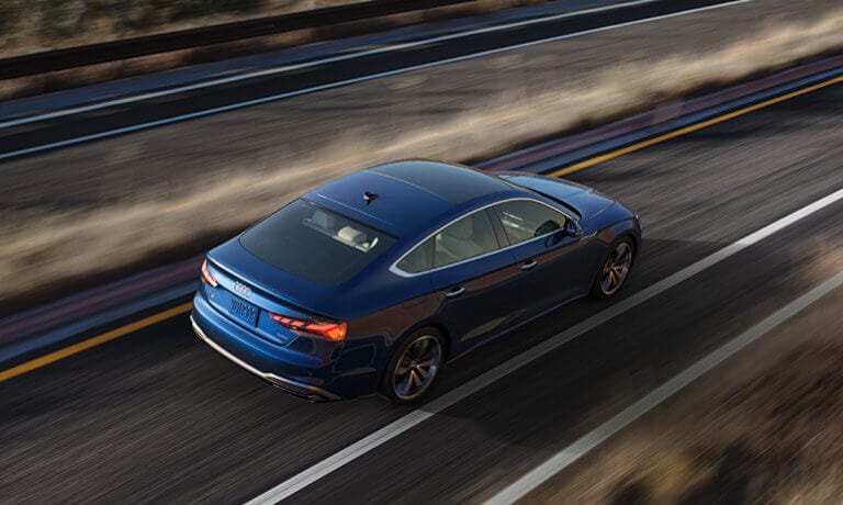2024 Audi A5 Sportback Exterior Driving On Blurred Desert Road