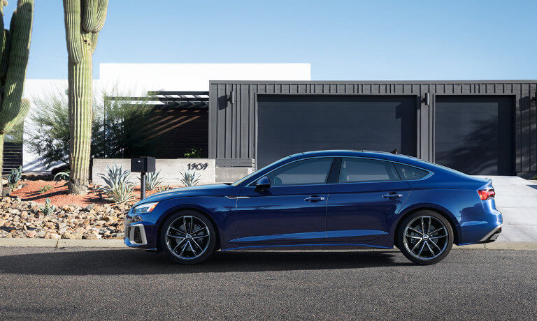 2024 Audi A5 Sportback Exterior Parked In Front Of Desert Home