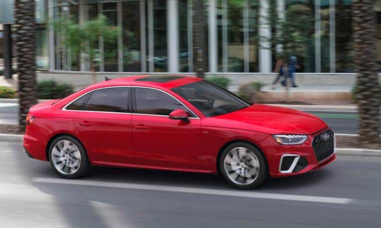 2022 Audi A4 exterior in red driving in the city