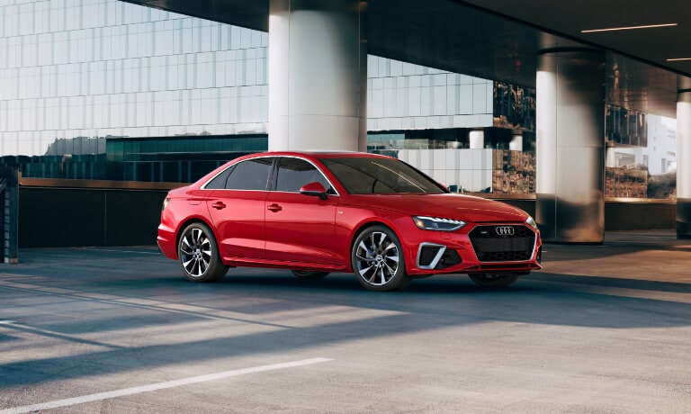 2021 Audi A4 in red exterior parked outside mall
